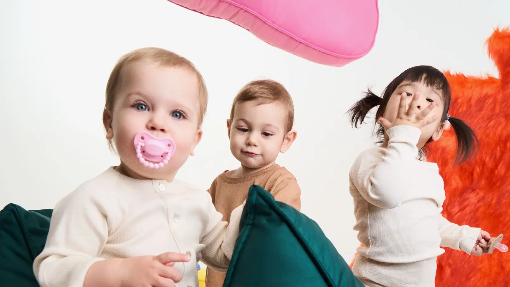 Children of various ages with pacifiers of different sizes